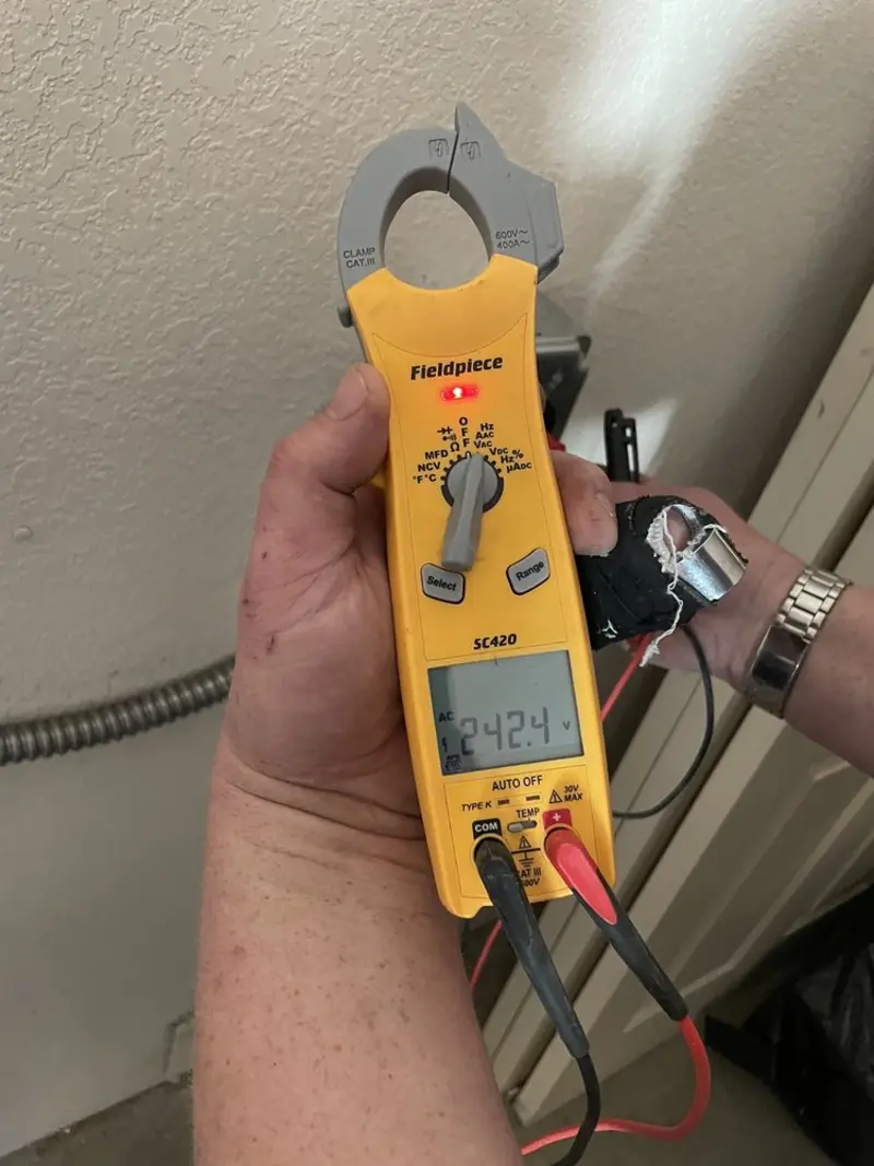 Voltage testing with clamp meter during Ceiling Fan Installation in Clear Lake